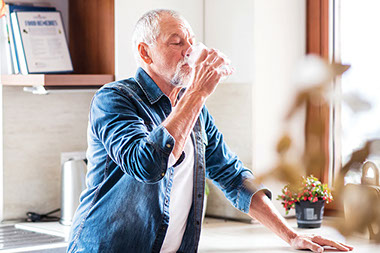 Man drinking a glass of water. Man drinking a glass of water.