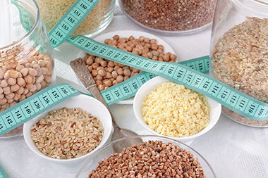 Fiberize your kitchen. Image of different grains in bowls and jars.