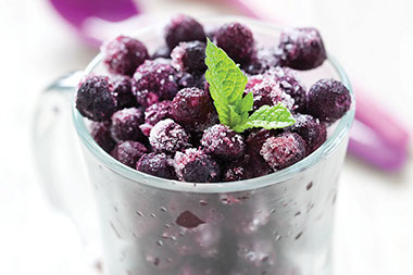 Image of frozen berries in a glass. Image of frozen berries in a glass.