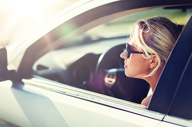 Teen sitting in driver seat of car. Teen sitting in driver seat of car.