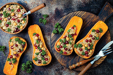 Stuffed butternut squash with chickpeas, cranberries, quinoa cooked in nutmeg, cloves, cinnamon.