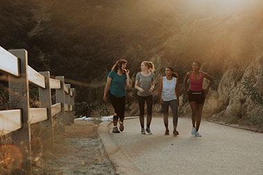 Friends hiking through hills. Friends hiking through hills.