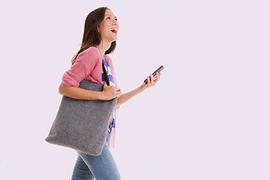 Women walking and talking on the phone. Women walking and talking on the phone.