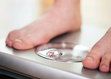 Image of feet on a scale.