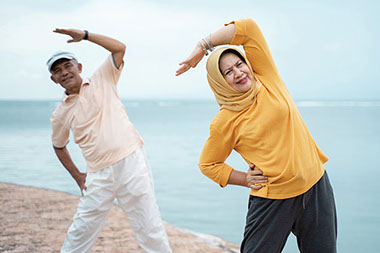 Couple outside stretching.