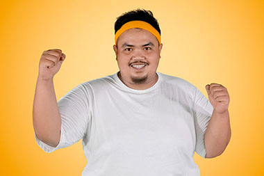 Man expressing his success to lose weight. Man expressing his success to lose weight.