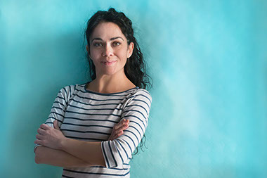 Women with arms crossed looking convinced and confident. Women with arms crossed looking convinced and confident.