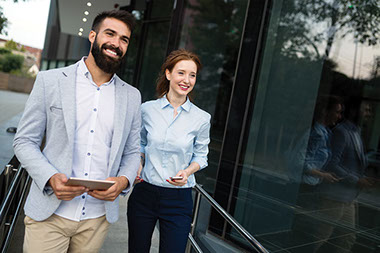 Coworkers walking outside.