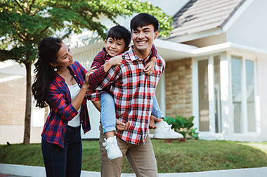 Image of young family outside of home. Image of young family outside of home.