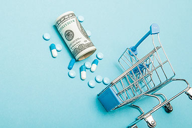 Small shopping cart with pills and money.