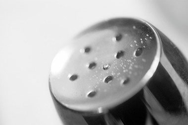 Close up image of the top of a salt shaker.