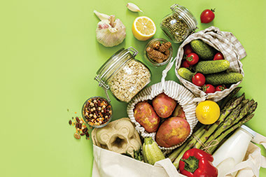 Variety of food items on green table. Variety of food items on green table.