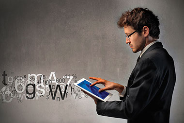 Image of man using a tablet.