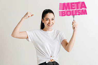 Women flexing arm while holding a fork in the other hand, with the word "Metabolism".