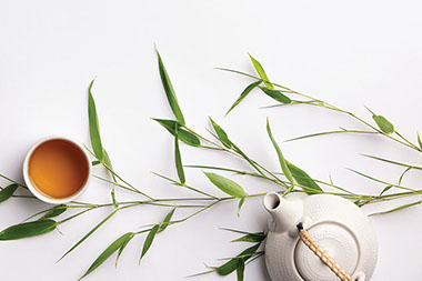 Top view cup of tea and tea pot.