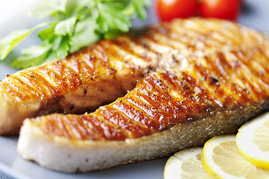 Image of cooked fish ready to eat on a plate.