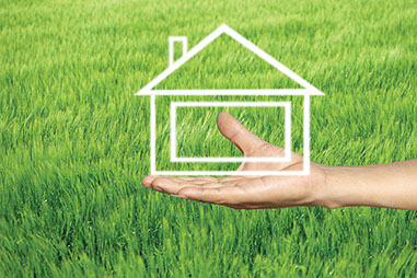 Image of hand holding an illustration of a home.