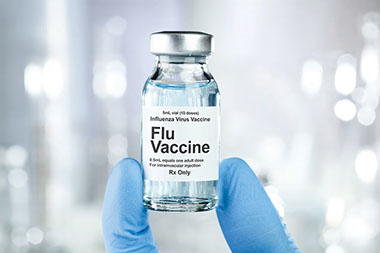 Flu vaccine in bottle.