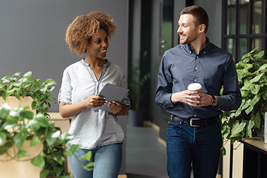 Two people walking and talking.