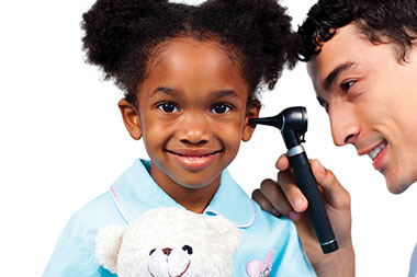Prevent ear infections. Image of doctor looking into a child's ear.