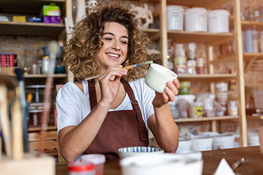 Women working on pottery.