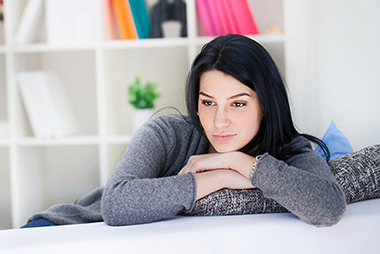 Image of women sitting and thinking.