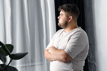 Man staring out of the window. Man staring out of the window.