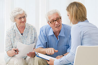 Image of older couple talking to agent.