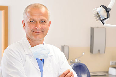 Is stress hurting your teeth? Image of male dentist.