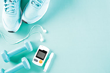 Gym shoes, dumb bells, headphones, glucose meter.