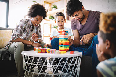 Family playing Jenga. Family playing Jenga.