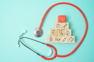 Wooden blocks with medical icons.
