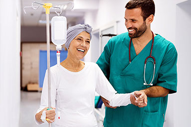 Doctor helping patient walk.