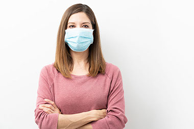 Women wearing a face mask. Women wearing a face mask.