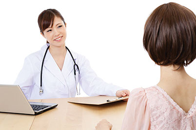 Image of women talking with her doctor.