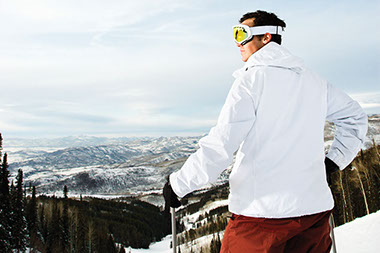 The downside of skiing-falls and spills. Image of man on top of a skiing slope.