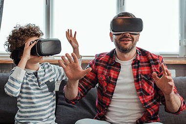 Father and son playing virtual games. Father and son playing virtual games.