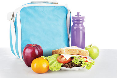 Image of lunch bag with a water bottle, a sandwich, apples and orange.