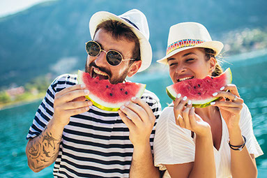 Couple eating watermelon.