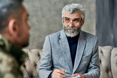 Mental health counselor listening to patient.