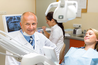 image of dentist with patient.
