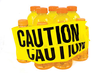 Wired and dangerous. Image of sport drinks with yellow "Caution" tape wrapped around the bottles.