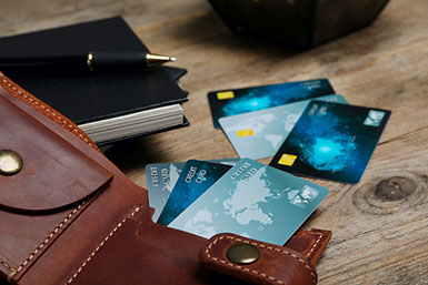 Credit cards fanned out on table.