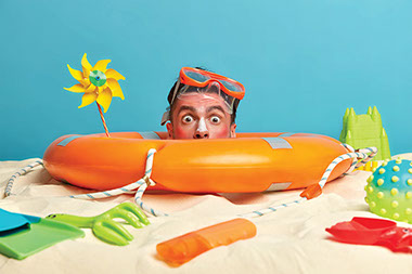 Man's sun burn face popping out of swimming tube. Man's sun burn face popping out of swimming tube.