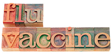 Image of blocks that spell out "flu vaccine".