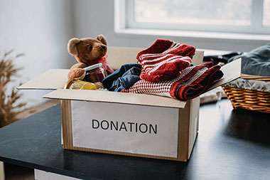 Box filled with items labeled "Donation." Box filled with items labeled "Donation."