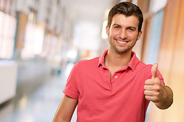 Image of smiling man with thumbs up.