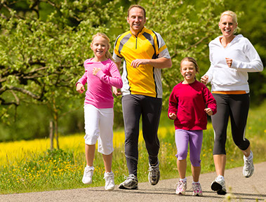 Image of family jogging together.