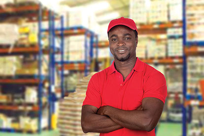 Image of young man working at a warehouse.