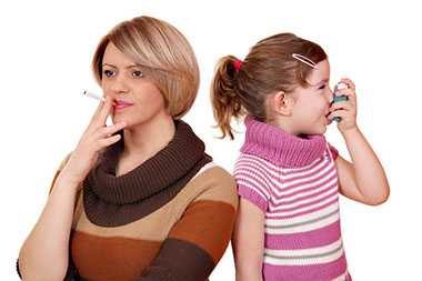 Image of women smoking and child using an asthma inhaler.